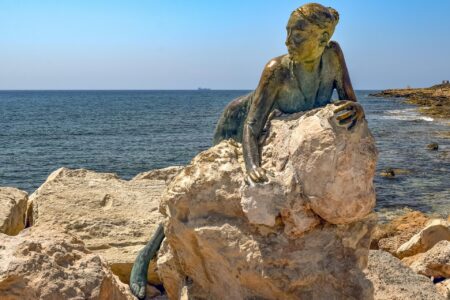 Sol Alter — Bronze Sculpture of a Woman on a Rock in Paphos